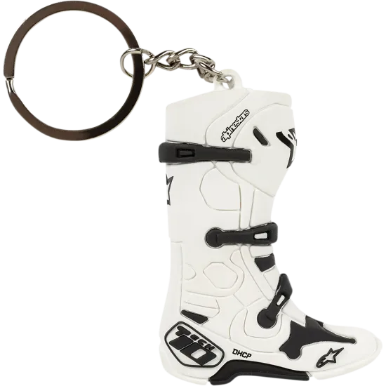 Бял ключодържател Alpinestars Tech 10 с черни каишки, метална халка и верижка, показващ детайлна миниатюрна реплика на мотобота