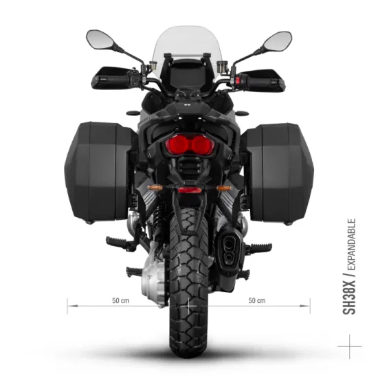 Сребристо-сив Moto Guzzi Stelvio 1000 2024 с монтирани черни SHAD куфари - горен и два странични, показващ пълната 3P система