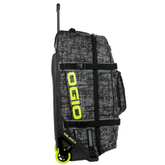 Сив сак с колела OGIO RIG 9800 PRO в дизайн CHAOS с черни презрамки, телескопична дръжка и включени черна раница и чанта за ботуши с ярко зелени логота