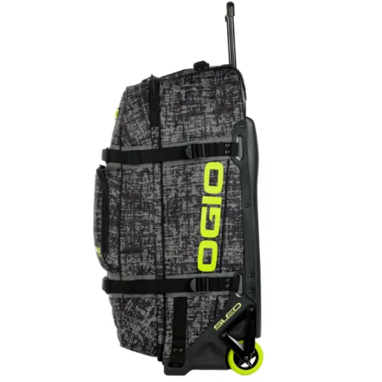 Сив сак с колела OGIO RIG 9800 PRO в дизайн CHAOS с черни презрамки, телескопична дръжка и включени черна раница и чанта за ботуши с ярко зелени логота