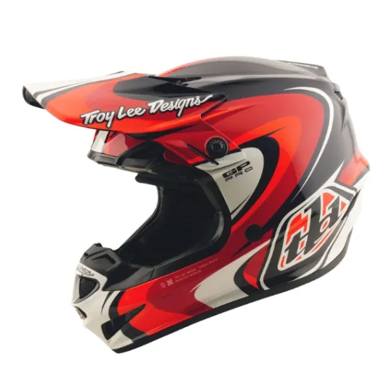 Детска мотокрос каска Troy Lee Designs GP Pro в червено-черна цветова схема с бели акценти, показваща агресивен графичен дизайн и логото на TLD