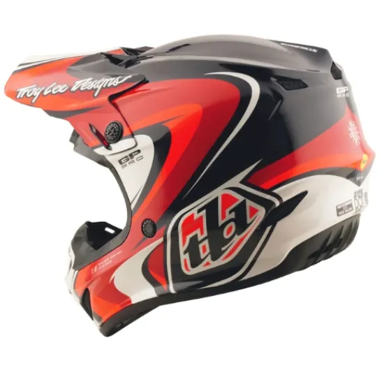 Детска мотокрос каска Troy Lee Designs GP Pro в червено-черна цветова схема с бели акценти, показваща агресивен графичен дизайн и логото на TLD