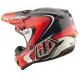 Детска мотокрос каска Troy Lee Designs GP Pro в червено-черна цветова схема с бели акценти, показваща агресивен графичен дизайн и логото на TLD