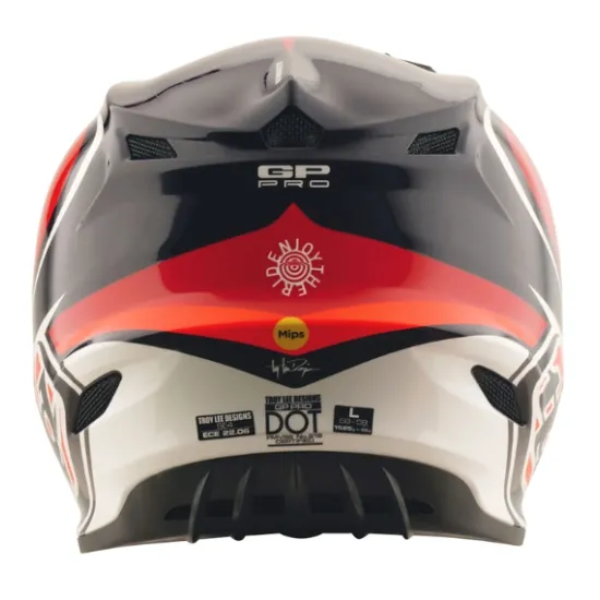 Детска мотокрос каска Troy Lee Designs GP Pro в червено-черна цветова схема с бели акценти, показваща агресивен графичен дизайн и логото на TLD