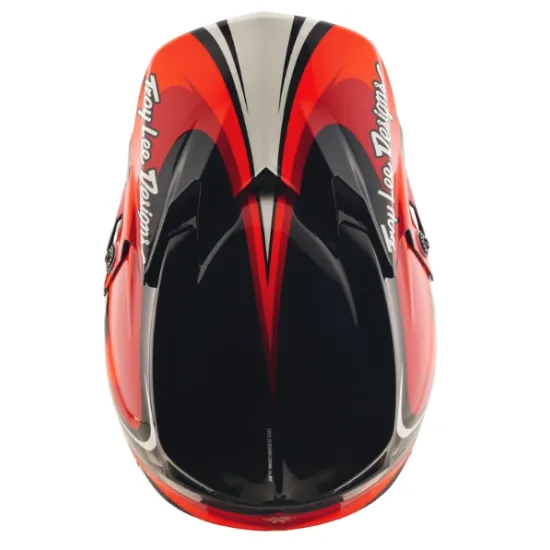 Детска мотокрос каска Troy Lee Designs GP Pro в червено-черна цветова схема с бели акценти, показваща агресивен графичен дизайн и логото на TLD