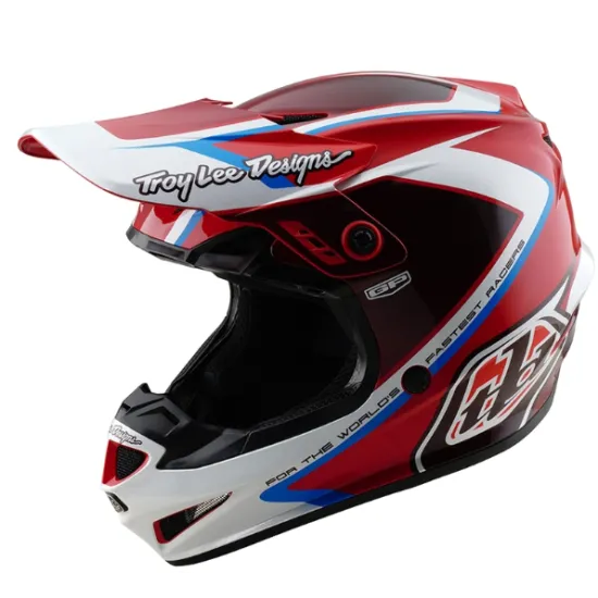 Червено-бяла детска мотокрос каска Troy Lee Designs GP Shutter с контрастни сини елементи, черен визьор и характерните TLD лога