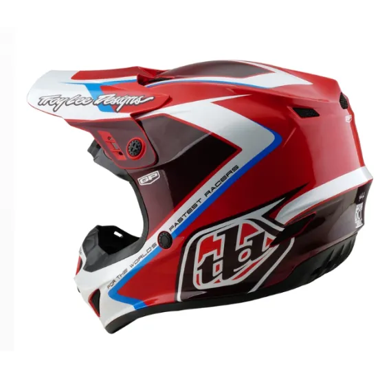 Червено-бяла детска мотокрос каска Troy Lee Designs GP Shutter с контрастни сини елементи, черен визьор и характерните TLD лога