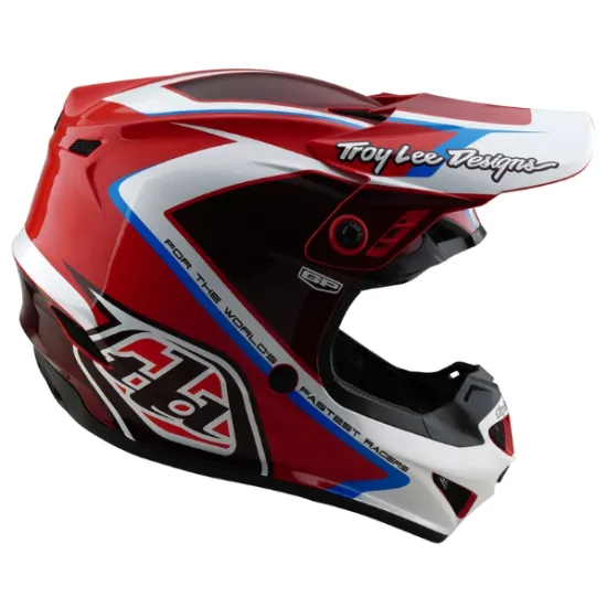 Червено-бяла детска мотокрос каска Troy Lee Designs GP Shutter с контрастни сини елементи, черен визьор и характерните TLD лога
