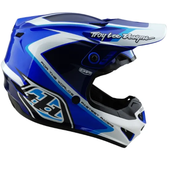 Детска мотокрос каска Troy Lee Designs GP Shutter в синьо-бяла цветова схема с геометричен дизайн, издължен визьор и множество вентилационни отвори