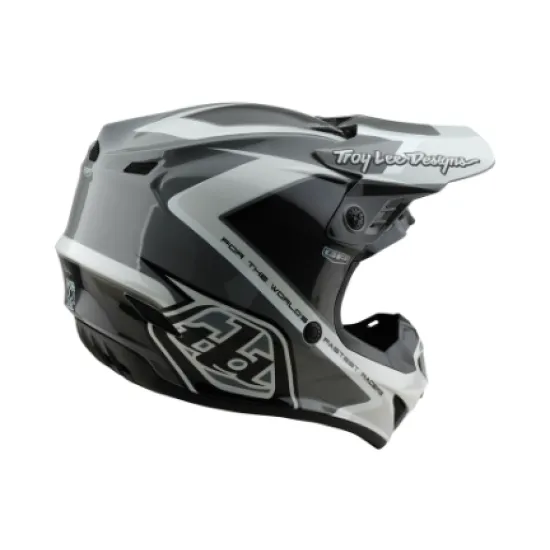 Сиво-бяла мотокрос каска Troy Lee Designs GP Shutter с геометричен дизайн, TLD лого и удължен визьор, показана от профил и отгоре