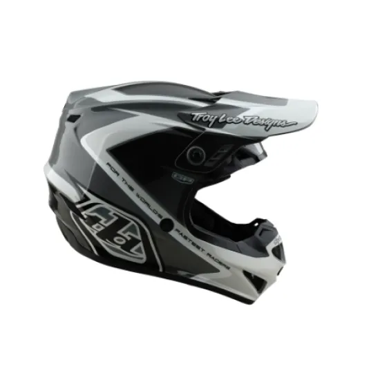 Сиво-бяла мотокрос каска Troy Lee Designs GP Shutter с геометричен дизайн, TLD лого и удължен визьор, показана от профил и отгоре
