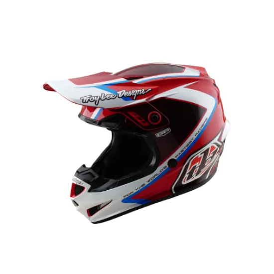 Червено-бяла мотокрос каска Troy Lee Designs GP Shutter с геометричен дизайн, сини акценти, черен визьор и множество вентилационни отвори