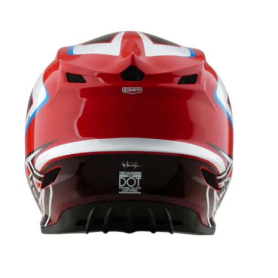 Червено-бяла мотокрос каска Troy Lee Designs GP Shutter с геометричен дизайн, сини акценти, черен визьор и множество вентилационни отвори