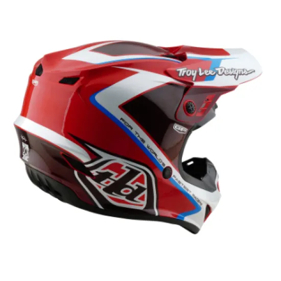 Червено-бяла мотокрос каска Troy Lee Designs GP Shutter с геометричен дизайн, сини акценти, черен визьор и множество вентилационни отвори
