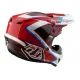 Червено-бяла мотокрос каска Troy Lee Designs GP Shutter с геометричен дизайн, сини акценти, черен визьор и множество вентилационни отвори