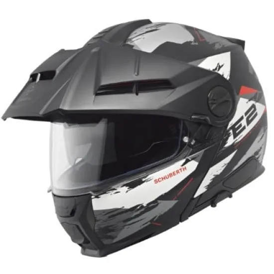 Сива адвенчър каска SCHUBERTH E2 Trail Grey с бяло-червен дизайн, регулируема козирка, двоен подбрадник и вентилационни отвори