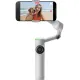 Сребрист видео стабилизатор Insta360 Flow 2 Pro с черен смартфон в щипка, показан в изправено положение с разгънат трипод и телескопична дръжка