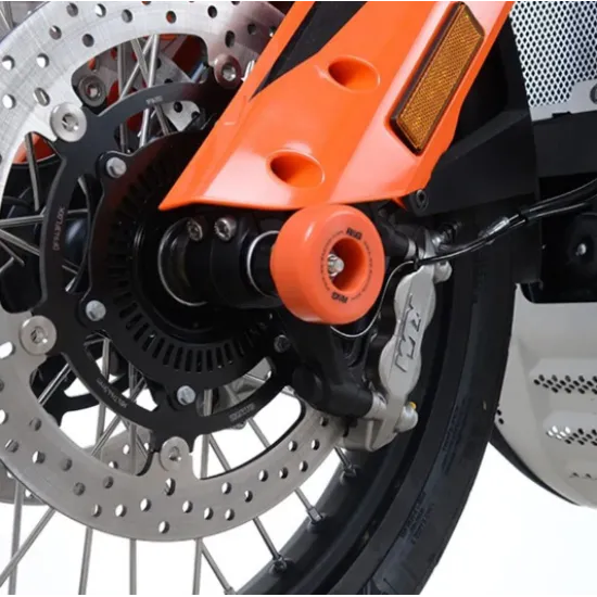 Оранжев краш тап R&G Racing монтиран на предна ос на KTM мотоциклет с перфориран спирачен диск и черна вилка