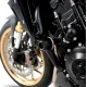 Черни краш тапи R&G Racing монтирани на двигател Honda CB1000 Hornet - цилиндричен амортисьор с бяло лого R&G, изглед от три