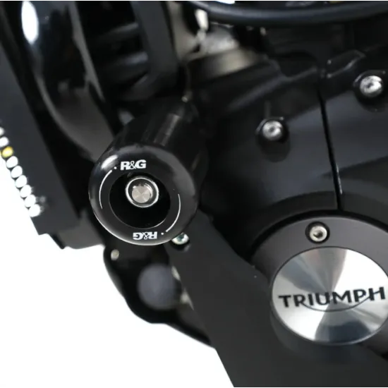 Черни краш тапи R&G Racing Aero монтирани в рамката на Triumph Speed 400 до бронзовата изпускателна тръба