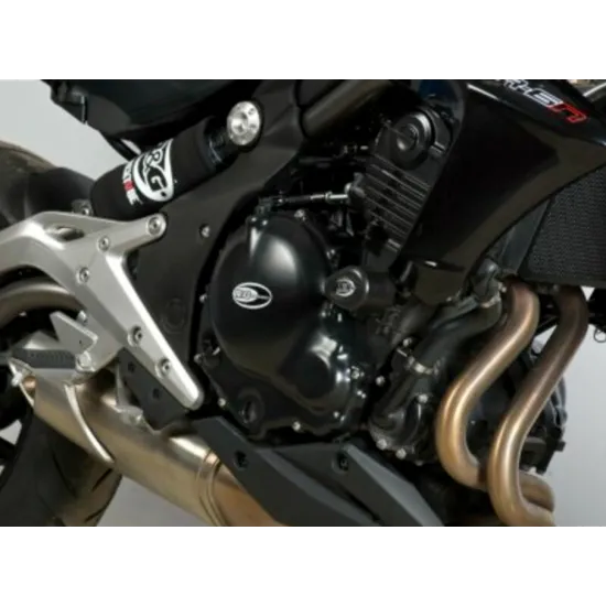 Черни краш тапи R&G Racing с капковидна форма монтирани на черна рамка на Kawasaki мотоциклет със златисти тръби от изпускателна система
