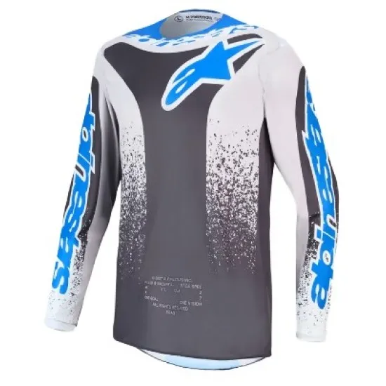 Alpinestars Fluid Drag мотокрос джърси в тъмно сиво, бяло и синьо с графика на разпръснати частици и логото на Alpinestars